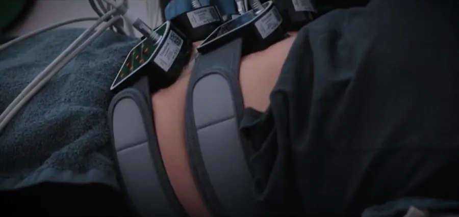 Body contouring applicators fastened across a patient during a session