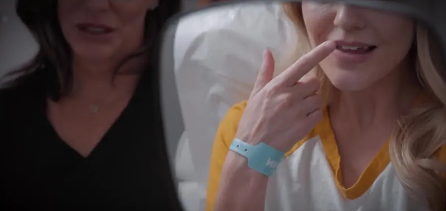 A provider talking a patient through their treatment plan at a mirror