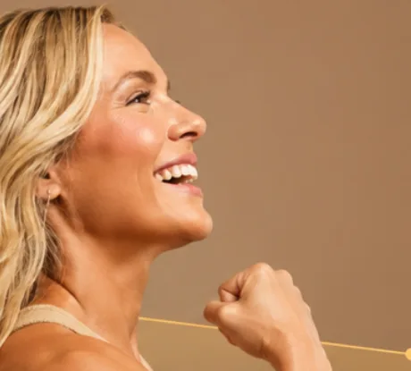 A person smiling in natural light