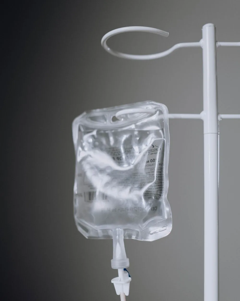 An intravenous infusion bag on a stand